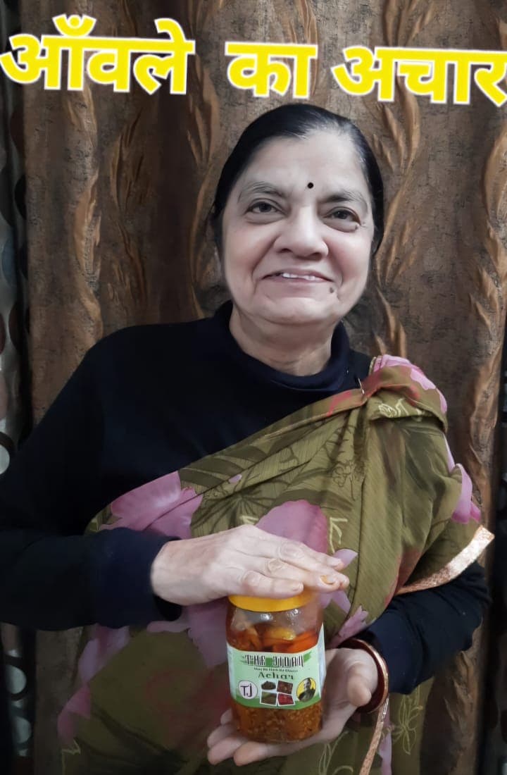 Dadi holding a jar of The Jidan pickle